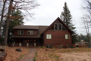 The front of the house with a nice sidewalk leading to the driveaway