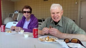 Couple enjoying steak sandwiches from Super One