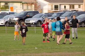 Kids were out on the practice field playing some football.