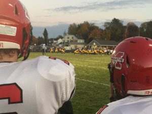 Redmen players looking on.