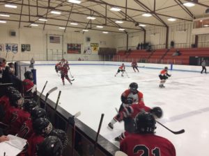 Scramble in the neutral zone for the loose puck.