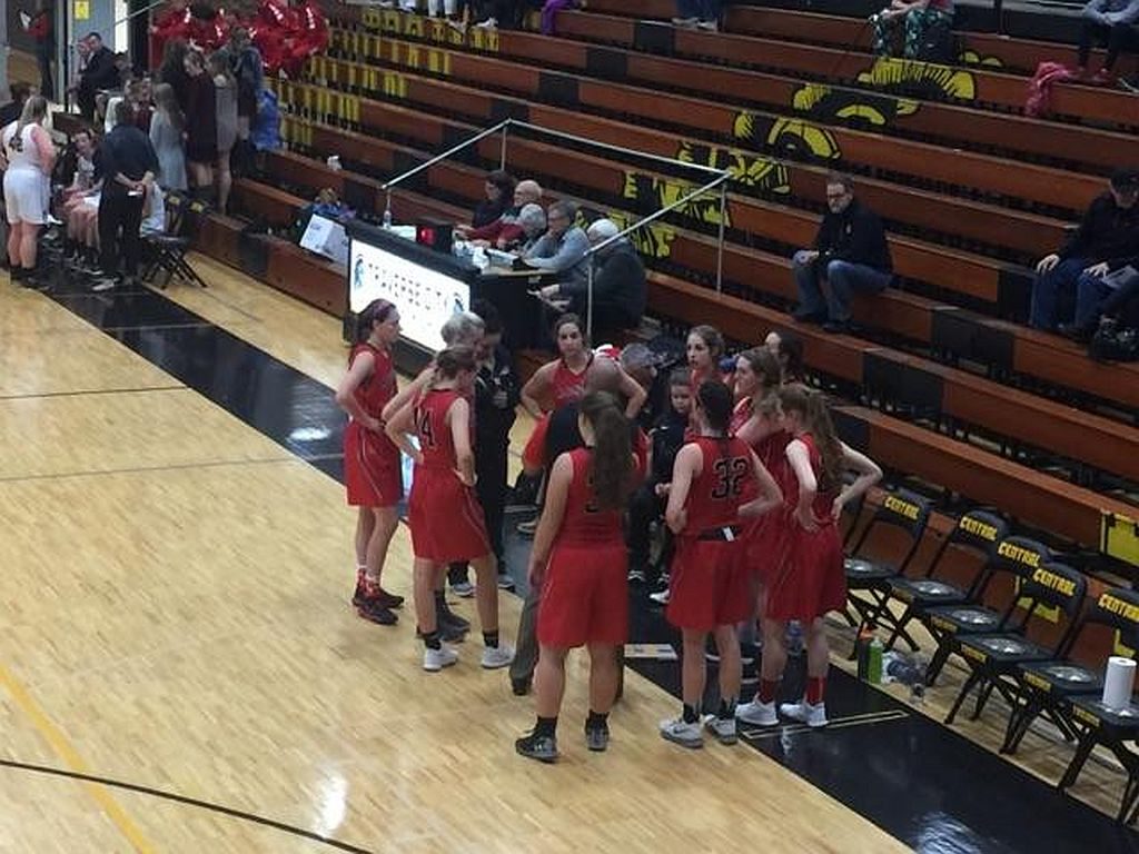 The Redettes go over their plan for the game