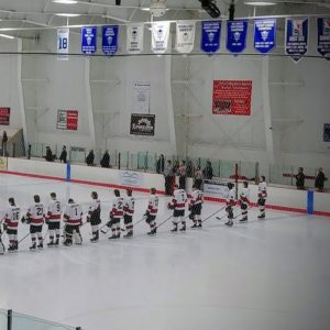 The Redmen line up for the National Anthem.