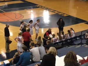 Coach Ben Smith draws up a play for his team.