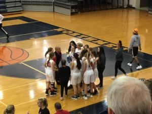 Coach Ben Smith congratulates his team.