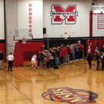 Redette Bridget Pliska goes off the court through a tunnel of fans