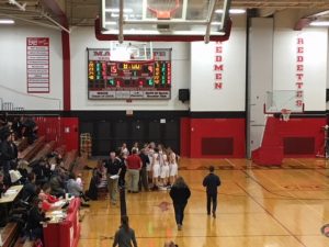 Marquette coach Ben Smith gives his team some last-minute instructions
