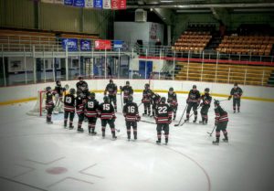 The Redmen get ready to play.