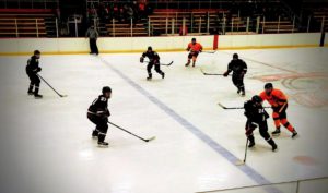 Marquette Redmen transition through the neutral zone.