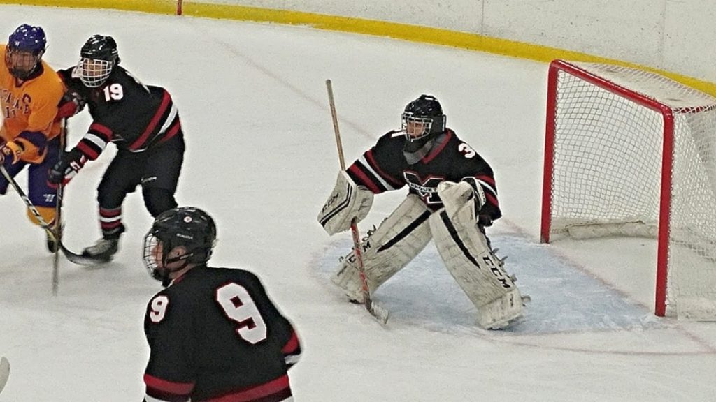 Marquette's goalie is ready to make the save.