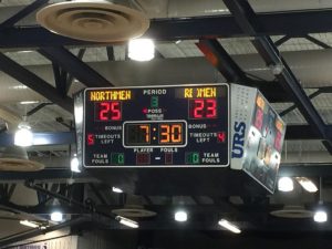 At halftime, the Petoskey Northmen lead the Marquette Redmen 25-23
