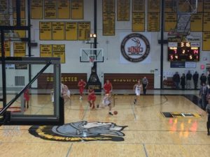 The Trojans take possession and head toward the Marquette end