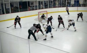The Redmen and the Hornets facing off in Marquette's zone