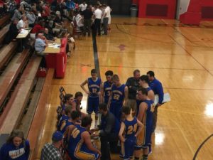 Kingsford draws up a play. Their offense clicked against Marquette.