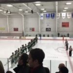The Traverse City West Titans lined up for the national anthem