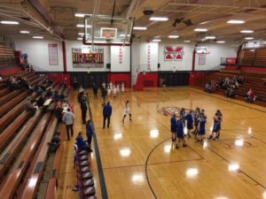 Marquette and Calumet at their benches before the game