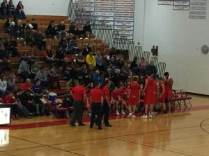 The Redmen get instructions from head coach Brad Nelson