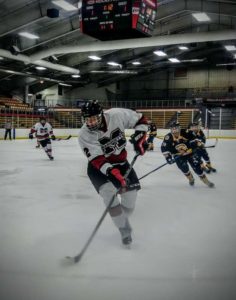 Andrew Pieper with the puck in his own zone