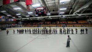 The two teams shake hands after a hard-fought game