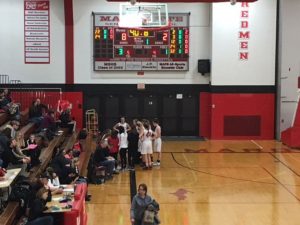 The Marquette Redettes going over their gameplan