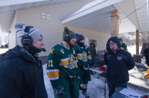 Ryan and Luke talking to the President and Captain of the NMU Hockey Club Team.
