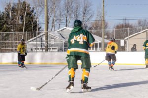 Playing on the ice at Lions Field in Marquette Township.