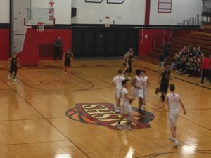 The Marquette Redmen Basketball Team defeats the Gwinn ModelTowners 65-35 on their home turf.