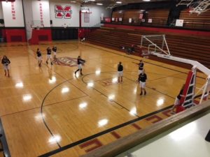 The Redettes and the Trojans warming up for the game