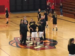 The captains of the two teams meeting with the referees