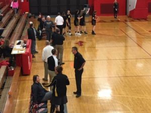Marquette coach Ben Smith and TCC coach Greg Farmer having a pre-game chat
