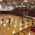 The Marquette Redettes and the Westwood Patriots warming up before the game