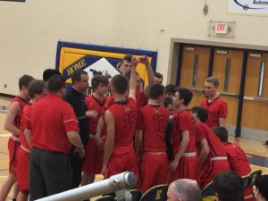 The Marquette Redmen at the bench before the game