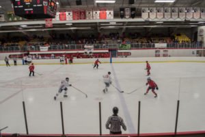 Kirby Frantti, #13 for the Pigs moving the puck down the ice.