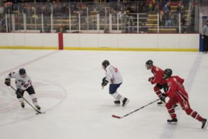Jim Herrington steals the puck putting it back in control of the Pigs.