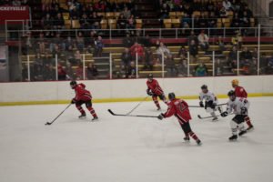 Jeff Sims takes the puck back down ice to the Pigs' zone.