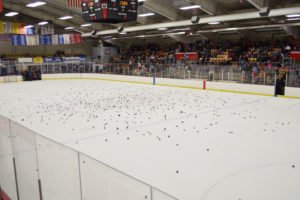 Look at all of those pucks on the ice.