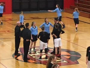The team captains talking with the officials