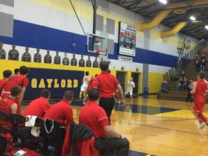 Marquette coach Brad Nelson looks on as his team attempts a shot