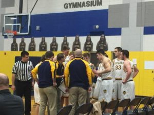 The Gaylord Blue Devils at their bench, going over strategies
