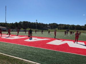 Marquette Redmen face off against Petoskey Northmen.