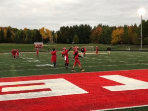 The Redmen warm up on a chilly night against the Gladstone Braves at home.