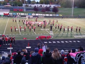 The Marquette Redmen Band keeps senior night festive on a chilly October evening.