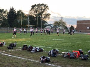 The Marquette Redmen warm up ahead of their bout against the Menominee Maroons.