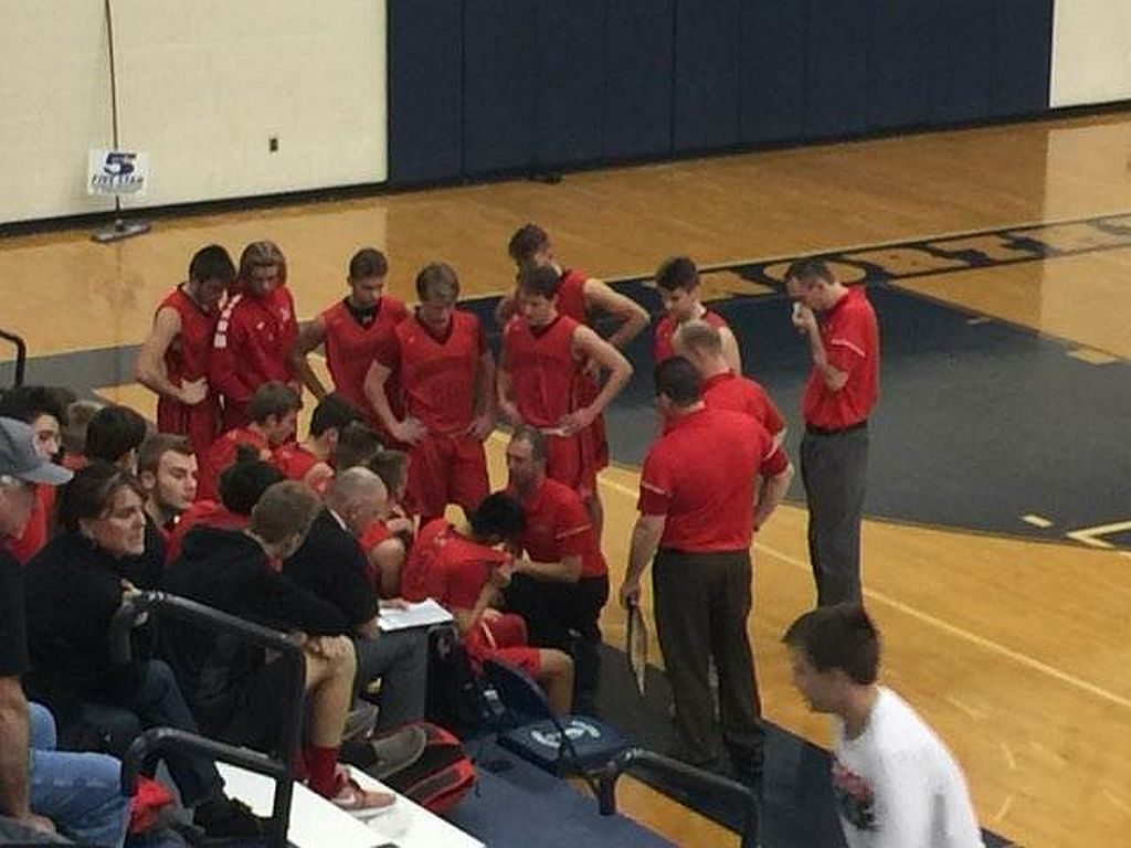 The Redmen strategize against the Brighton Bulldogs.