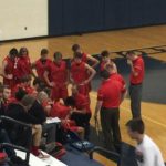 The Redmen strategize against the Brighton Bulldogs.