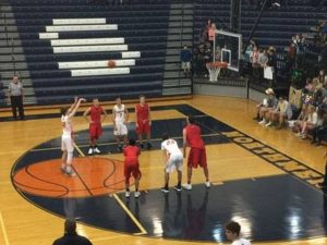 The Marquette Redmen watch as a Bulldog shoots a free throw.