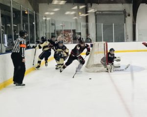 The Redmen with some action at the net!