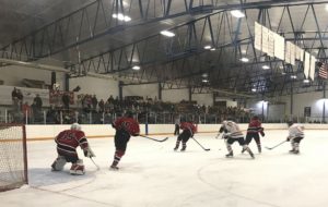 The Marquette Redmen face-off against the Escanaba Eskymos.