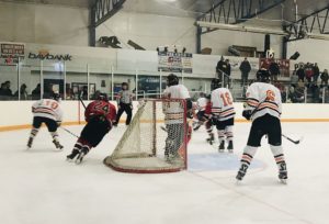 Some action behind the Eskymo goal for the Redmen.