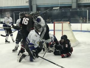 Ryan Baldwin, 16, in the scrum at the net.